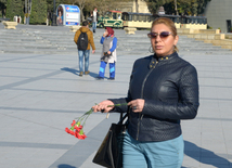 Baku residents bringing flowers to Seaside Boulevard to honor missing oil workers.  Azerbaijan, Dec.07, 2015